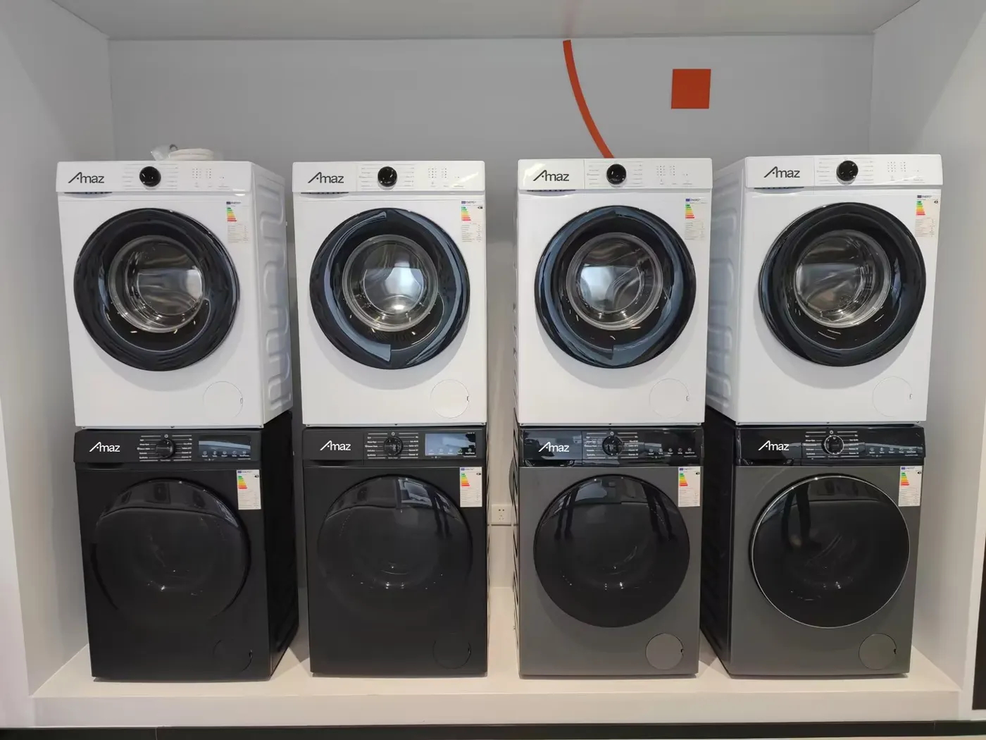 AMAZ front-load washers in the supplied showroom photograph